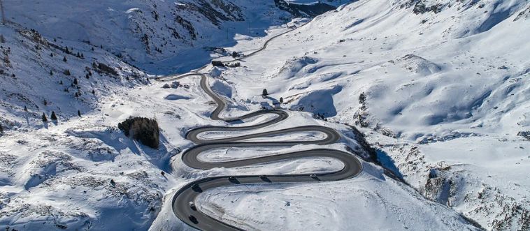 What is a super helpful skill for driving along those beautiful, winding mountain roads in the European Alps?