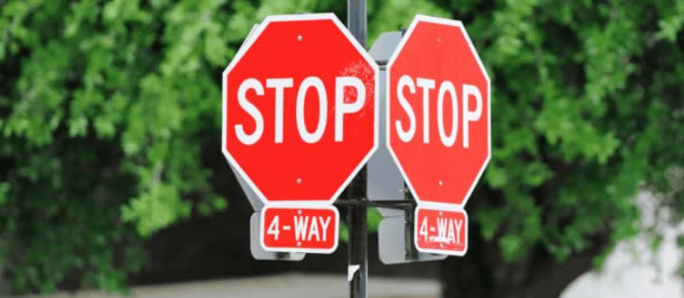 You’ve arrived at a cozy four-way stop! Do you know who gets to go first?